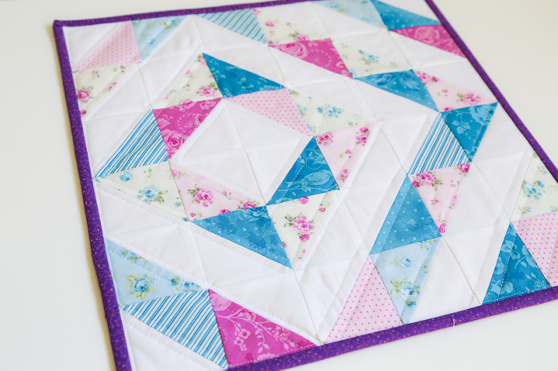 half square triangles, quilting with HST, HST quilt, mini charm squares quilt, eleanor burns quilt, quilts with diamonds, quilts for girls, mini quilts, floral mini quilts, purple quilts, blue quilts, purple quilt binding