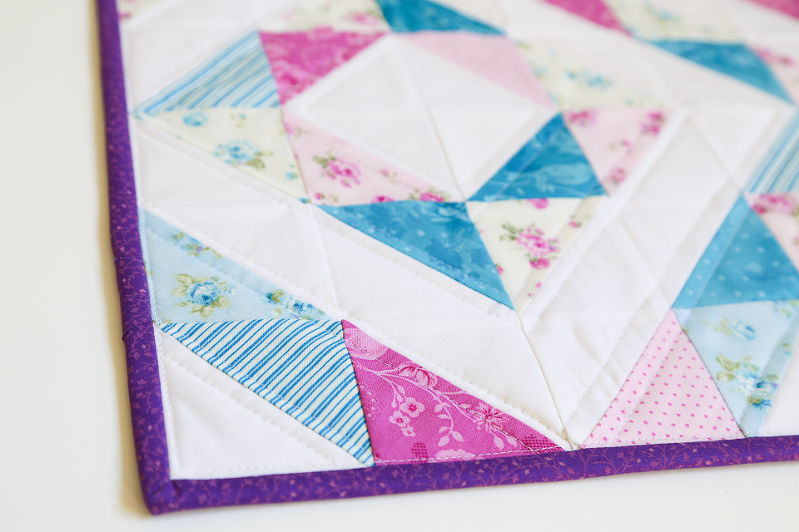 half square triangles, quilting with HST, HST quilt, mini charm squares quilt, eleanor burns quilt, quilts with diamonds, quilts for girls, mini quilts, floral mini quilts, purple quilts, blue quilts